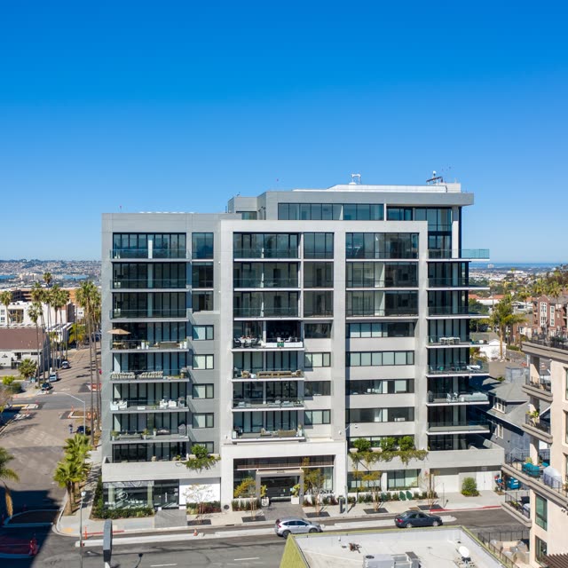 Low aerial view of the downtown streets, palm trees and homes at Bankers Hill.