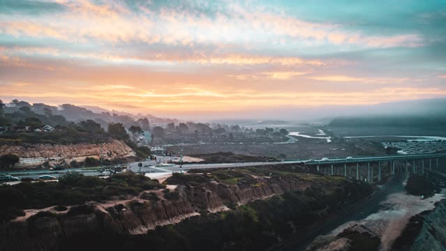 Aerial view of the cliffs, the bridge and traffic at Torrey Pines.
