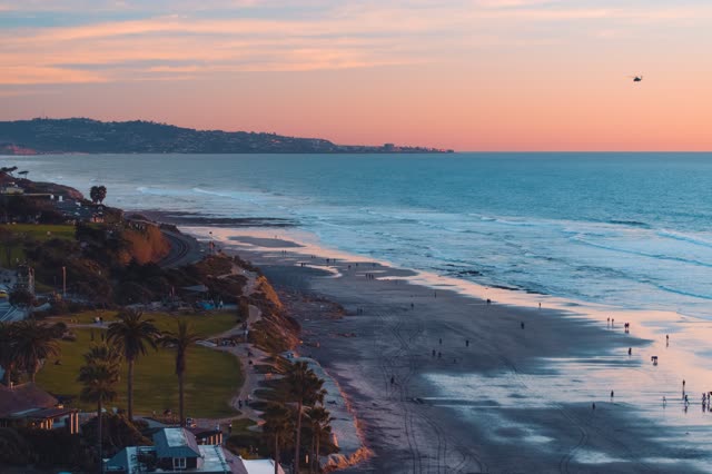 Powerhouse Park and Beach during a bright orange sunset | Photo – 9