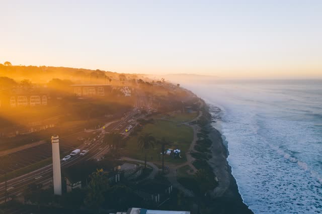 Aerial view of the cliffs, the ocean and traffic in Del Mar.