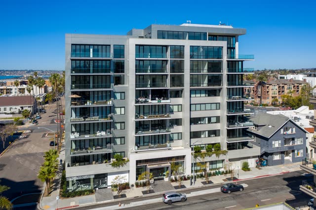 Low aerial view of the downtown streets, palm trees and the bay at Bankers Hill.