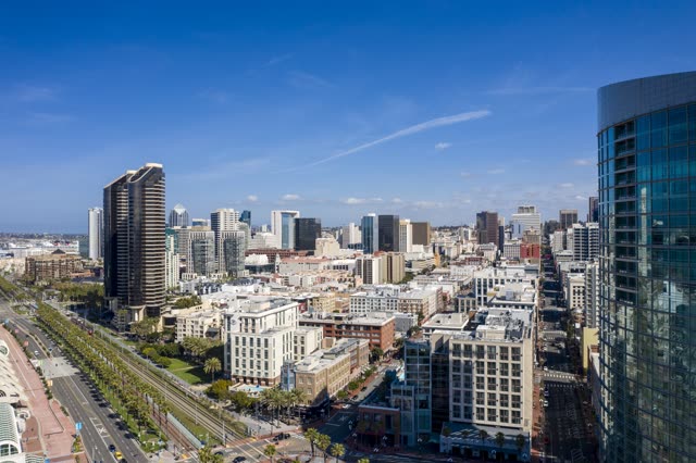 Aerial view of the downtown streets, the skyline and palm trees in Downtown San Diego.