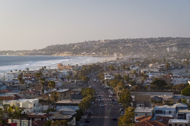 Aerial view of a residential street, the surf and the pier in Mission Bay.
