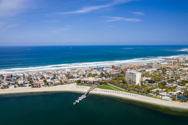 Aerial view of the beach, the surf and the pier in Mission Bay.