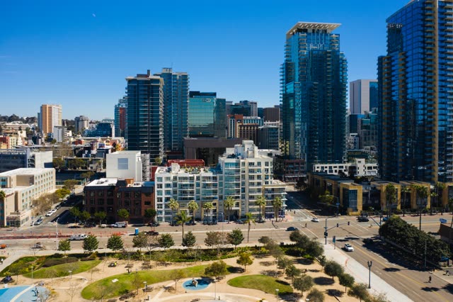 Aerial view of the downtown streets, the skyline and palm trees at Waterfront.