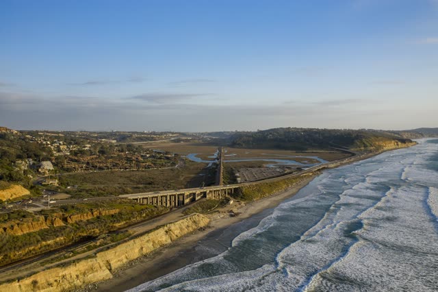 Aerial view of the cliffs, the surf and the ocean in Del Mar.