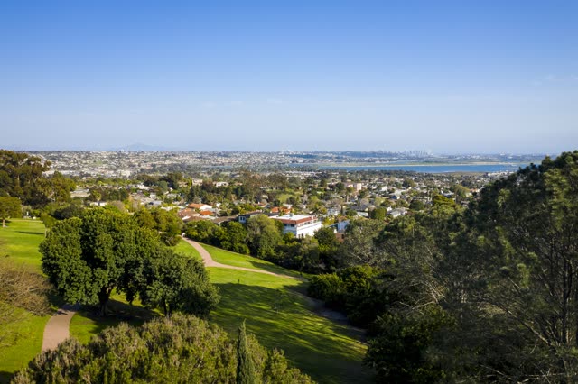 Elevated view of a residential street, the skyline and the bay in Pacific Beach.