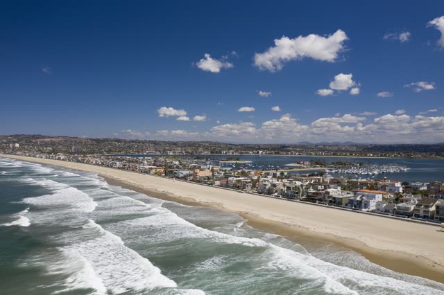Aerial view of the beach, the surf and boats in Pacific Beach.