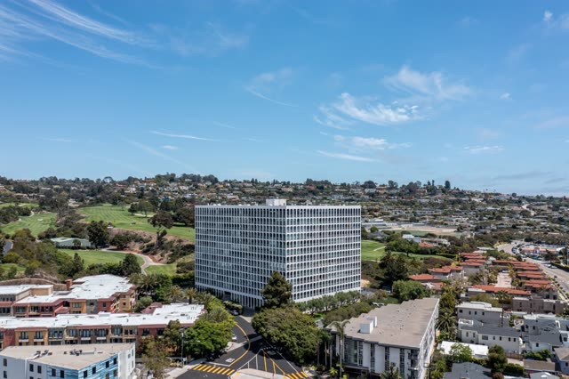 Aerial view of a residential street, homes and the buildings at La Jolla Country Club.