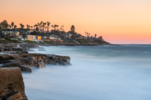 Elevated view of the cliffs, palm trees and the ocean at Windansea.