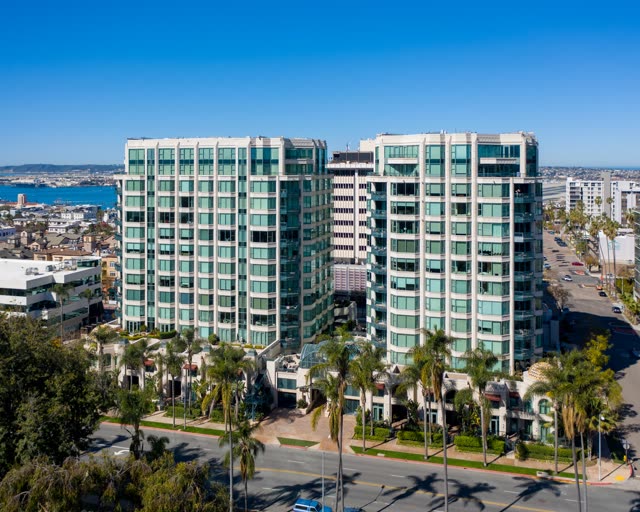 Low aerial view of the downtown streets, palm trees and the bay at Bankers Hill.