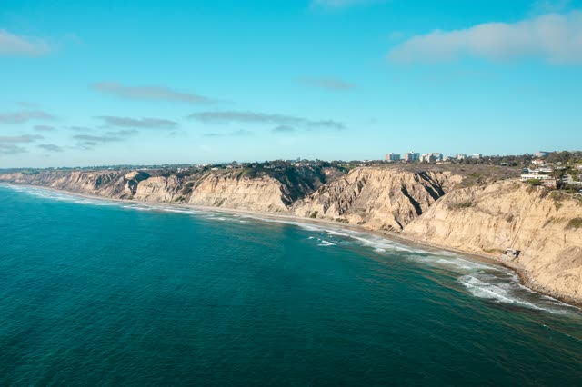 Aerial view of the cliffs, the ocean and homes at La Jolla Farms.
