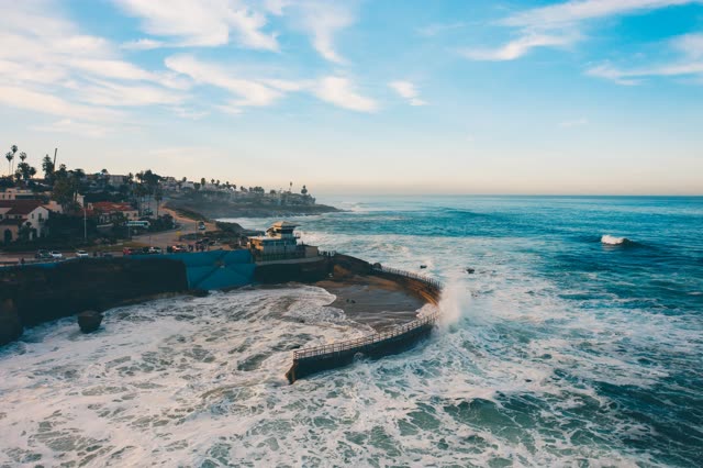 Waves breaking on the seawall at Children’s Pool in La Jolla | Drone Photo – 2