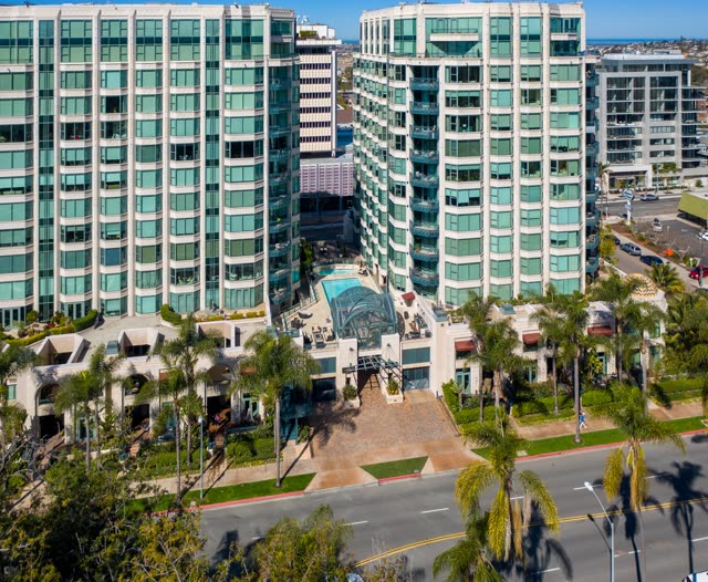 Low aerial view of the downtown streets, palm trees and homes at Bankers Hill.