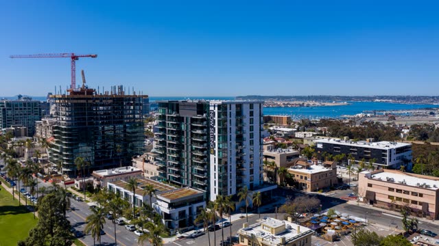 Aerial view of the downtown streets, boats and palm trees at Bankers Hill, with a work crew on site.