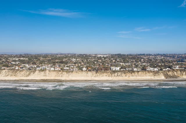 Aerial view of the cliffs, the surf and the ocean in Encinitas.